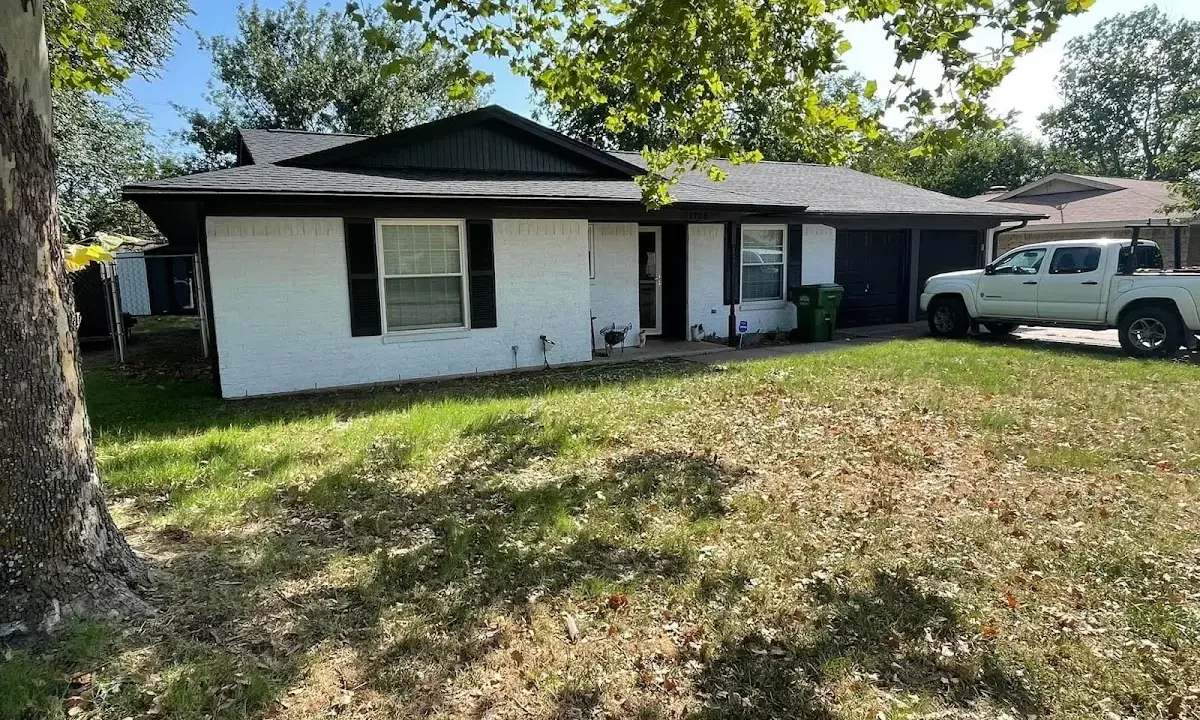 Professional roofing crew working on a residential roof in North St. Paul